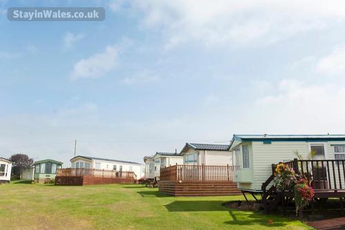 Caravans on the green at Ocean Heights, Vale Holiday Parks