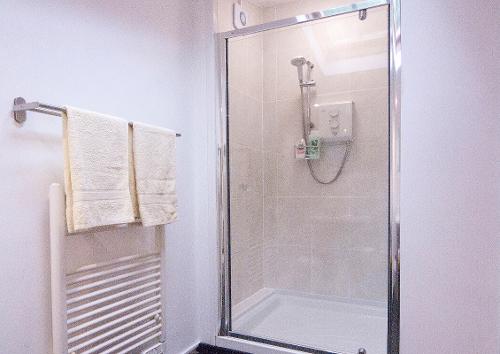 Electric shower and heated towel rail
