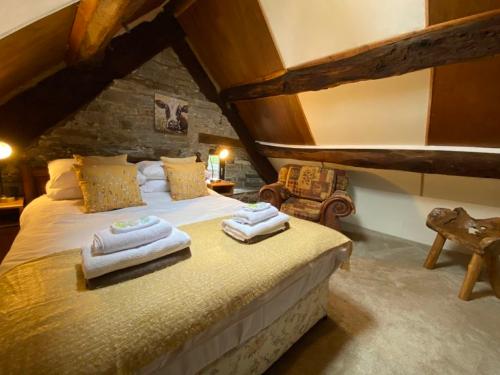Attic bedroom with king size bed and oak beams
