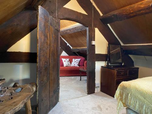 Attic seating area and traditional oak beams
