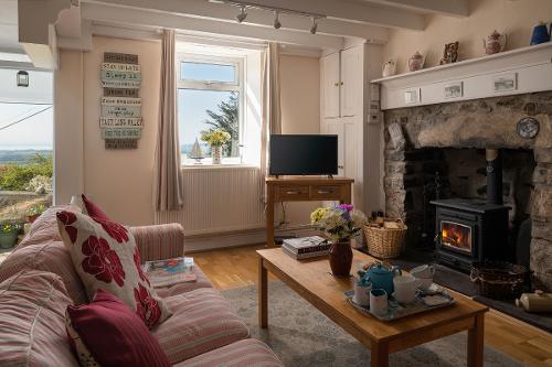Lounge with sofas and a woodburner