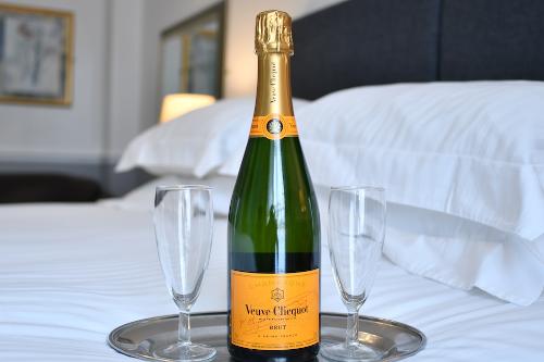 Enjoy a bottle of Champagne in your room