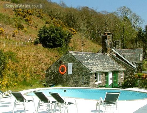 swimming pool adjacent to cottage